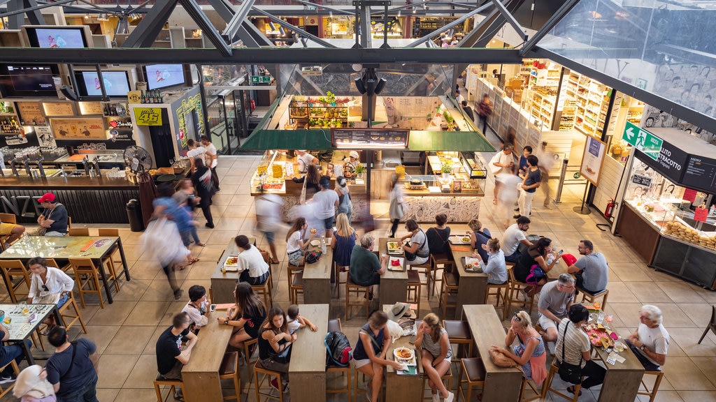 Central Market which includes dining out and interior views as well as a large group of people