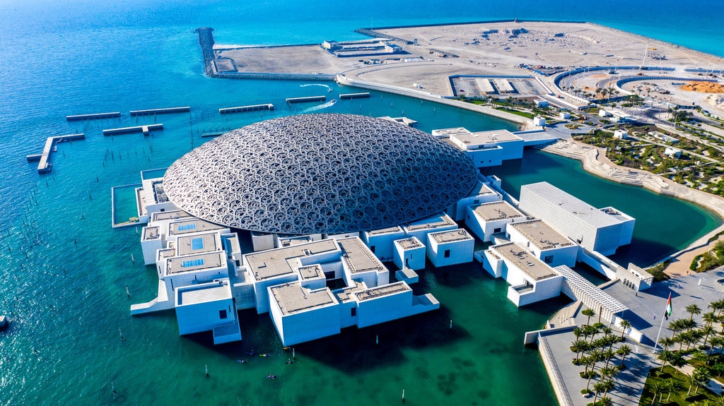 Louvre Abu Dhabi featuring modern architecture, general coastal views and landscape views