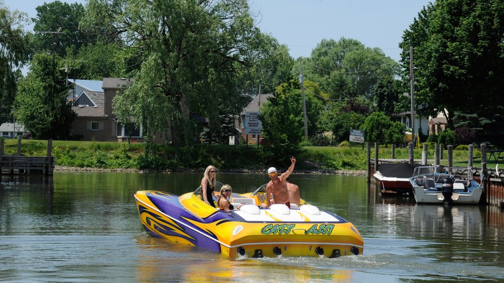 Chatham-Kent showing a bay or harbor and boating as well as a small group of people