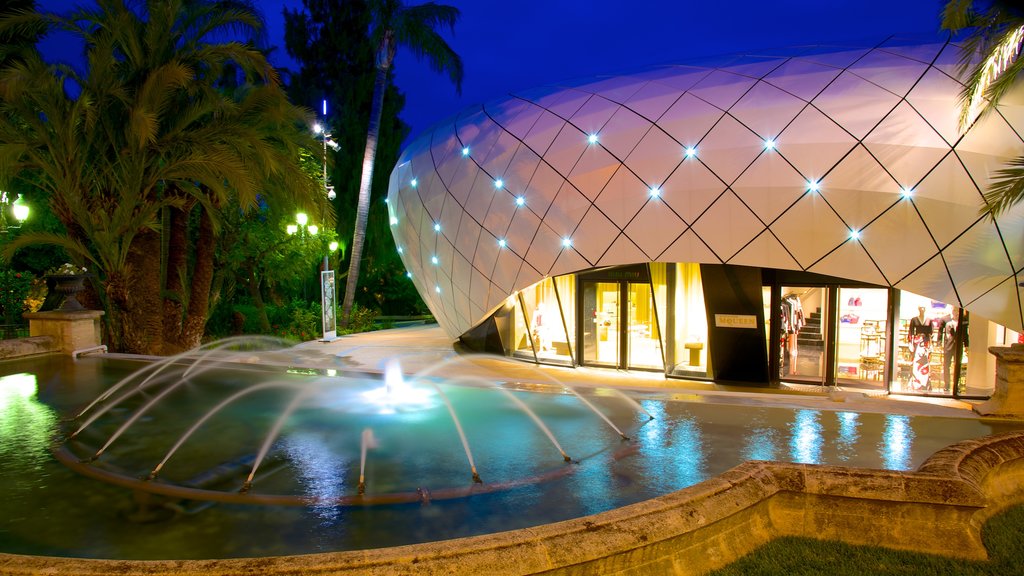 Plaza del Casino ofreciendo escenas nocturnas, arquitectura moderna y una fuente