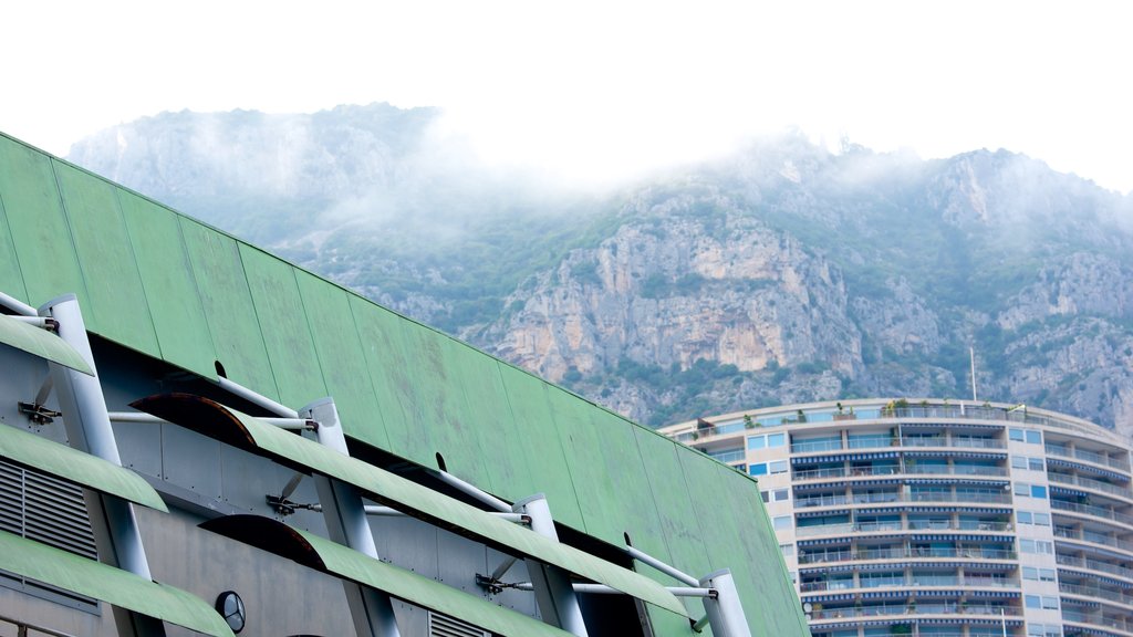 Grimaldi Forum showing mountains and mist or fog