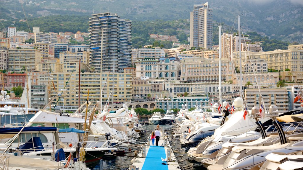 Monaco Harbour showing a coastal town and a bay or harbor as well as a family