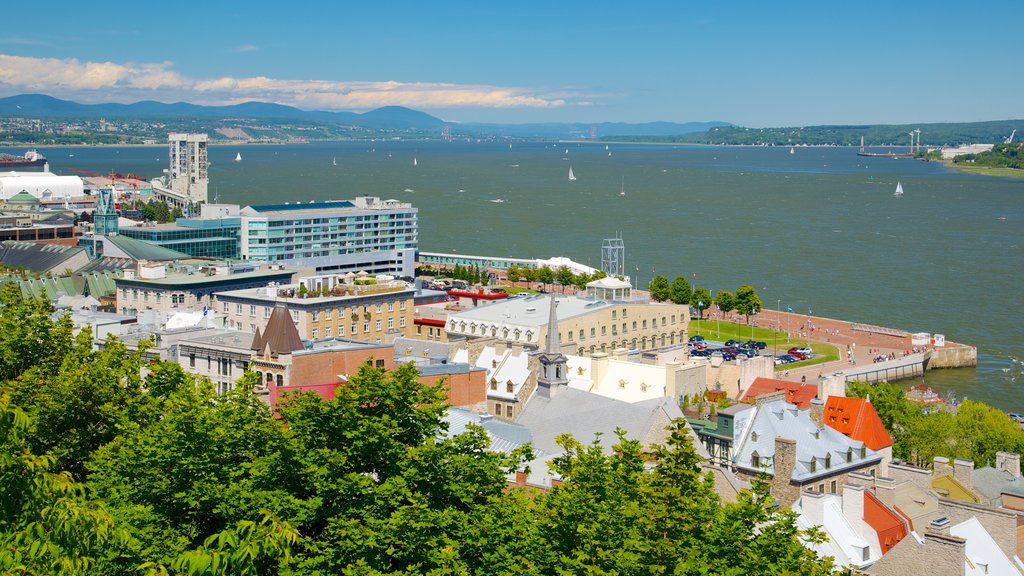 Parks Canada\'s Dufferin Terrace showing a lake or waterhole, a coastal town and a bay or harbour