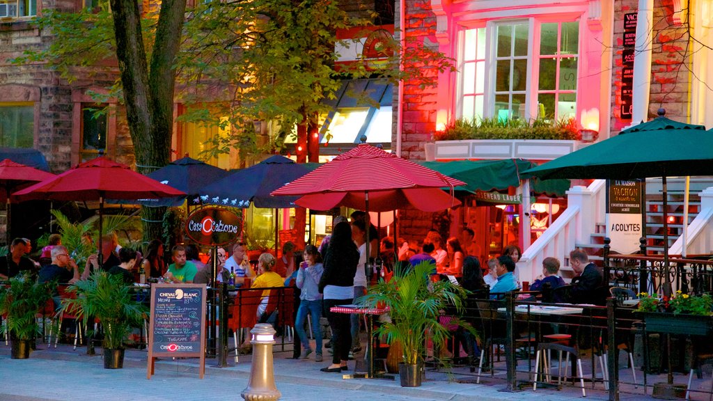 Grande Allee que incluye escenas de noche, comidas al aire libre y restaurantes