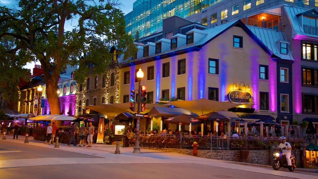 Grande Allee que incluye escenas nocturnas, comer al aire libre y escenas urbanas