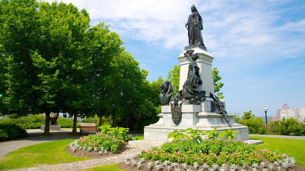 Parliament Hill showing flowers, a statue or sculpture and a garden