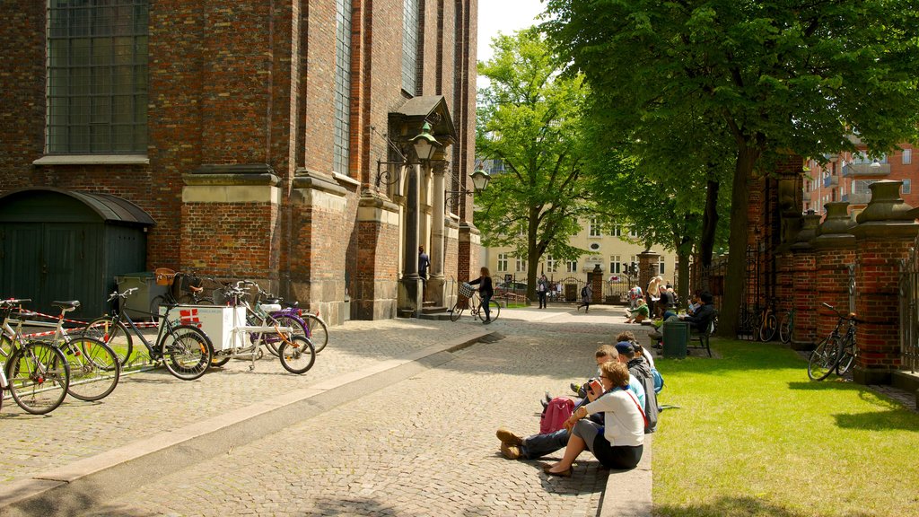 Church of Our Lady showing heritage architecture and a church or cathedral as well as a small group of people