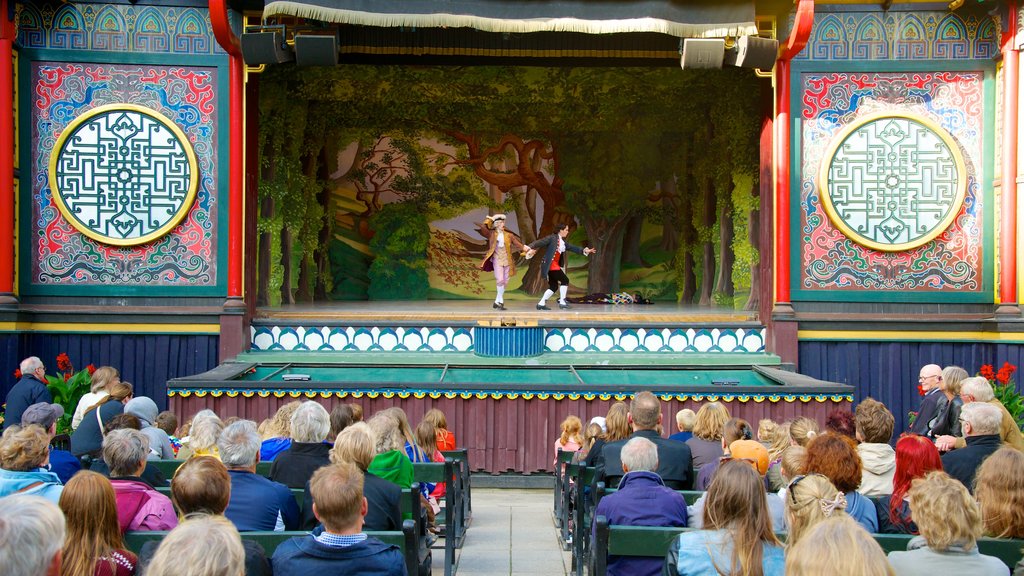 Tivoli Gardens showing rides, performance art and theater scenes