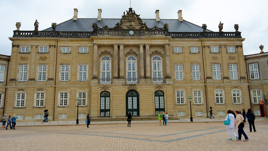 Amalienborg Palace which includes heritage architecture, a square or plaza and château or palace