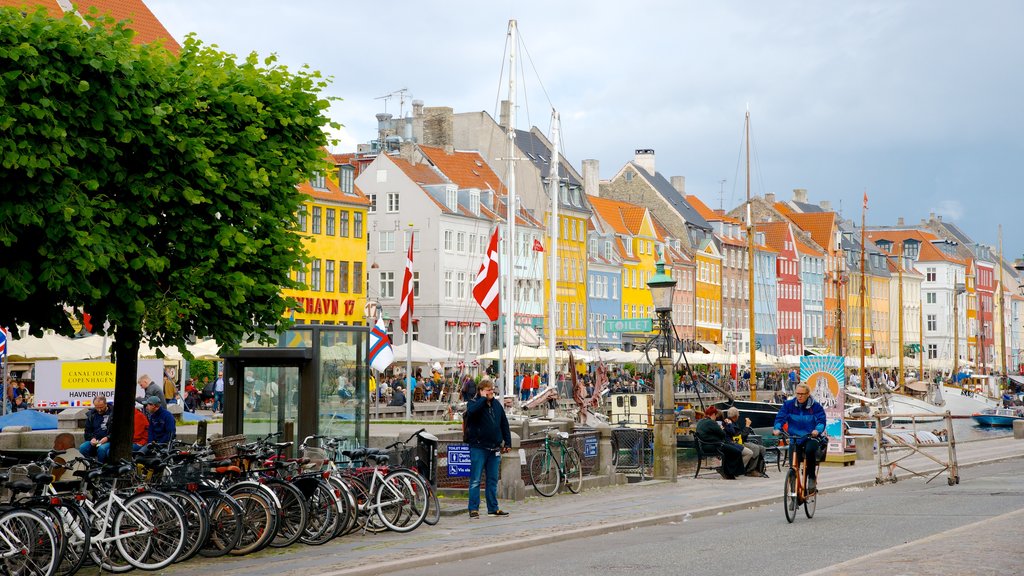 Nyhavn showing a city, heritage architecture and cycling