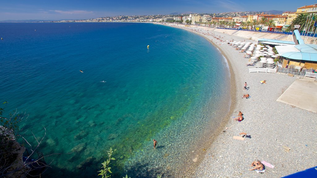 Promenade des Anglais showing a coastal town, a pebble beach and landscape views