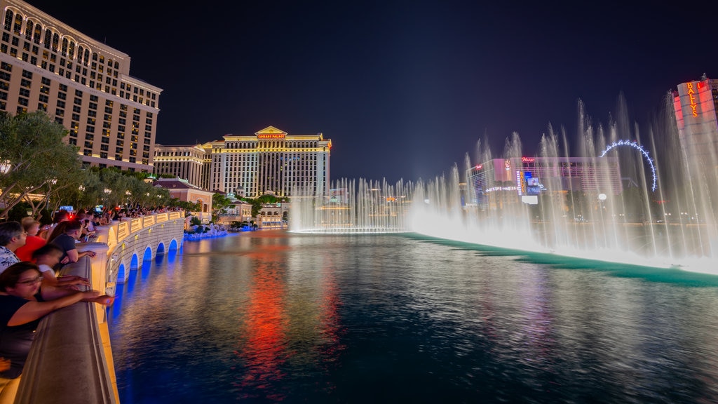 Bellagio Casino featuring a lake or waterhole, a city and a fountain