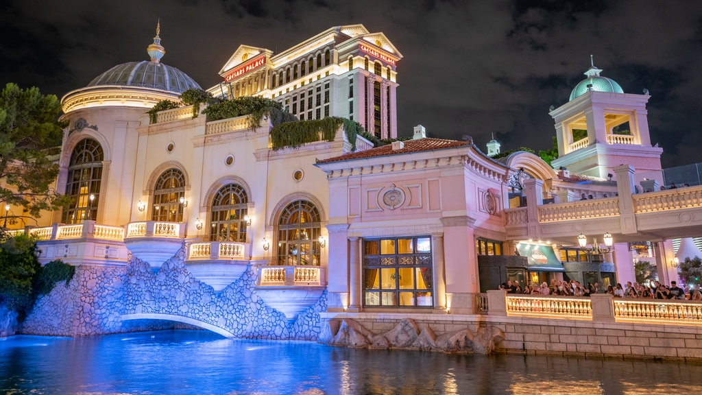 Bellagio Casino showing a river or creek, night scenes and a casino