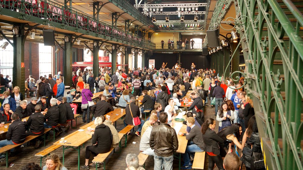 Fish Market which includes interior views and markets as well as a large group of people