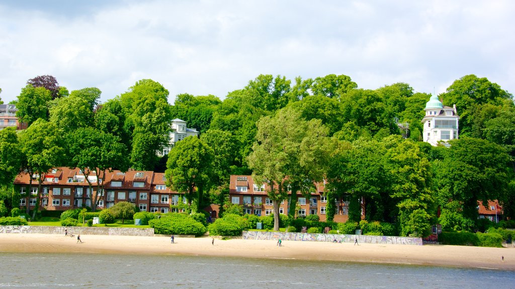 Hamburg Harbour which includes a bay or harbor, a beach and a coastal town