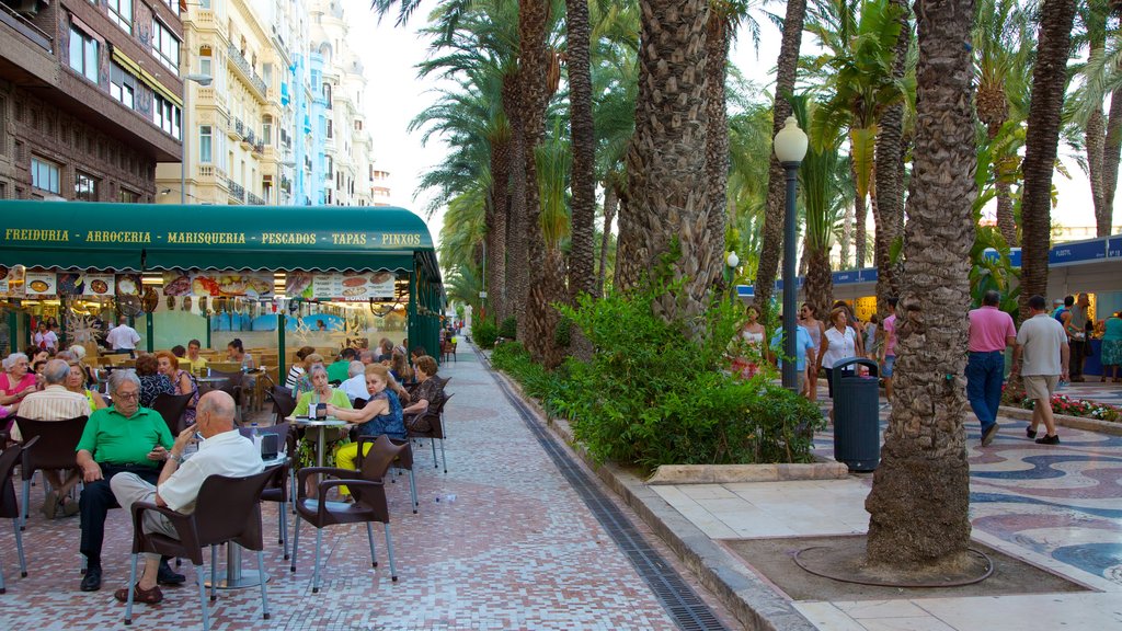 Explanada de Espana showing street scenes, a city and cafe scenes