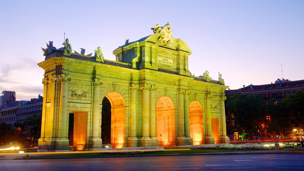 Puerta de Alcala featuring heritage architecture, night scenes and a city