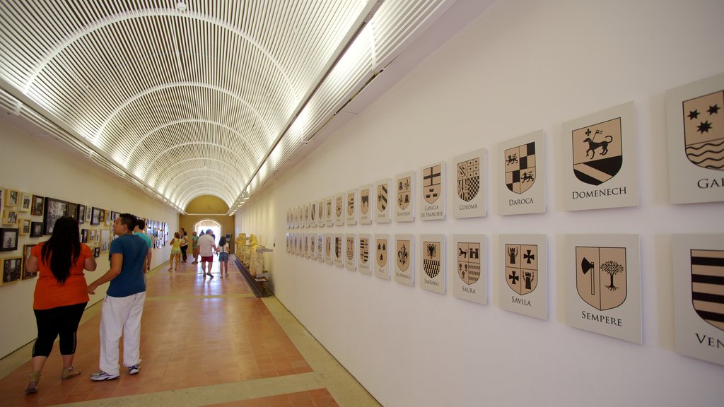 Castle of Santa Barbara showing interior views and château or palace as well as a small group of people