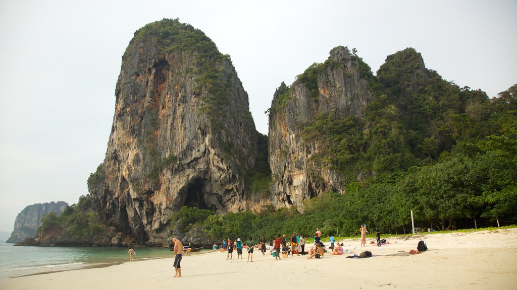 West Railay Beach which includes a bay or harbour, a gorge or canyon and a sandy beach