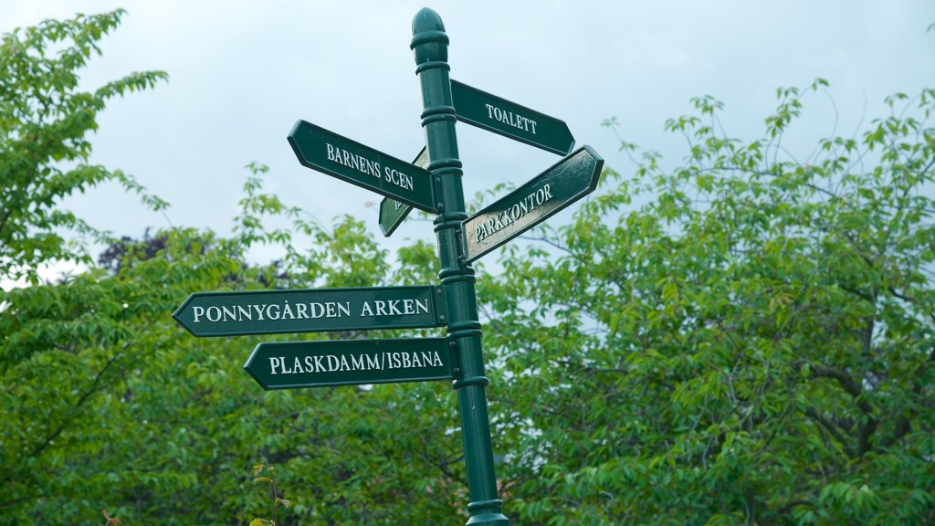 Folkets Park featuring signage and a garden