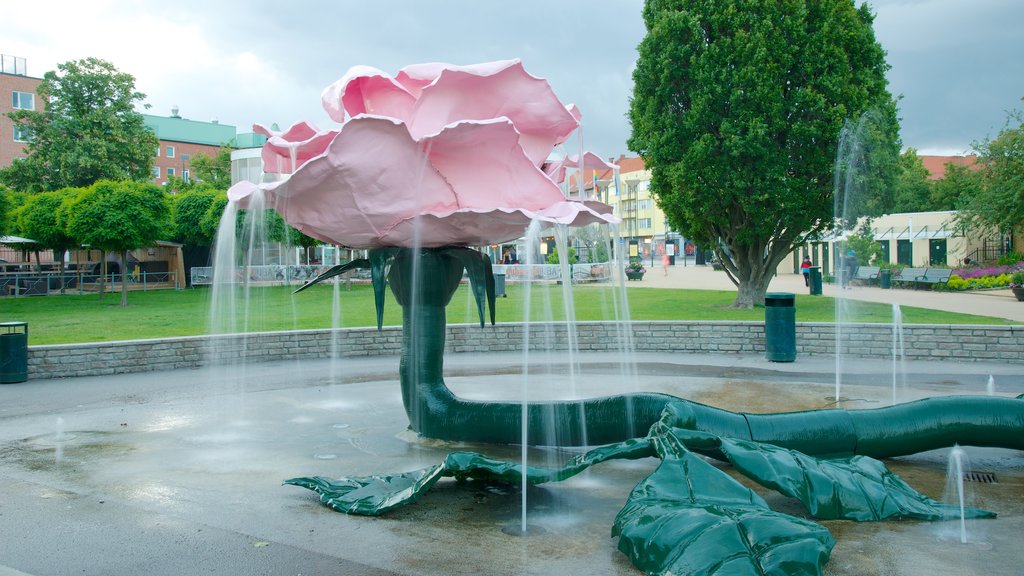 Parque Folkets mostrando una fuente y un parque