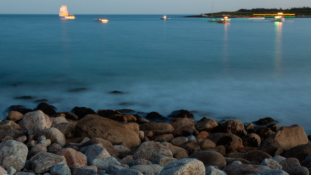 Crystal Crescent Beach showing landscape views and rugged coastline