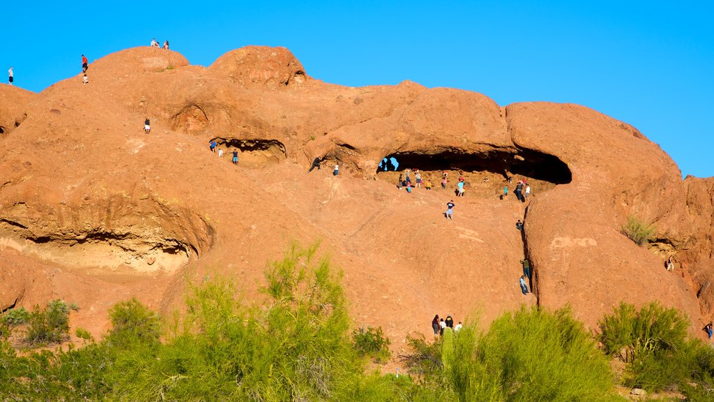 Hole in the Rock showing climbing and mountains