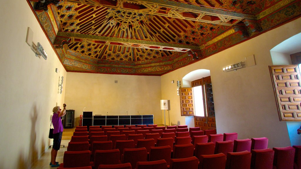 Granada showing interior views and a castle as well as an individual female