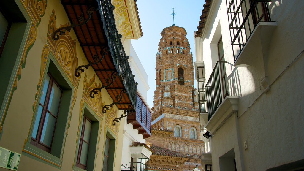 Poble Espanyol showing a church or cathedral, heritage architecture and a city