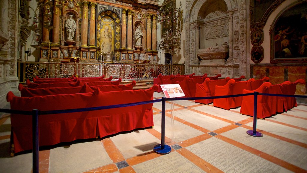 Seville Cathedral featuring interior views, art and religious elements