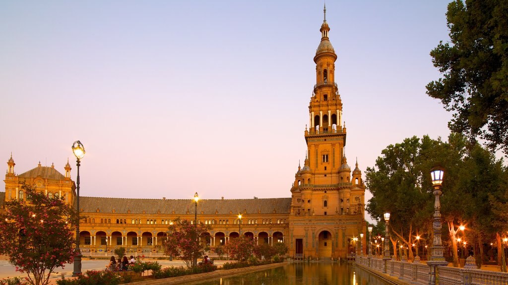 Plaza de Espana featuring château or palace, a pond and heritage architecture