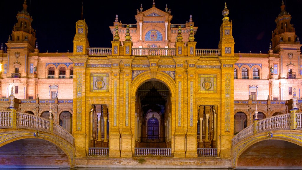 Plaza de Espana showing château or palace, night scenes and heritage architecture