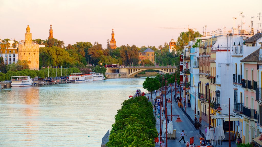 Triana Bridge showing a bay or harbour, street scenes and a river or creek