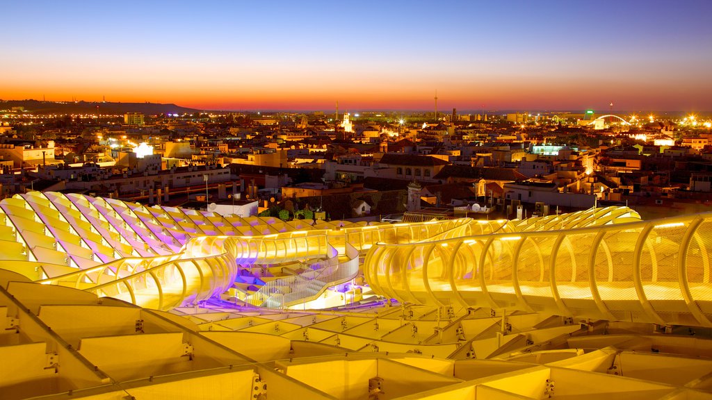 Metropol Parasol som omfatter moderne arkitektur, en by og en solnedgang