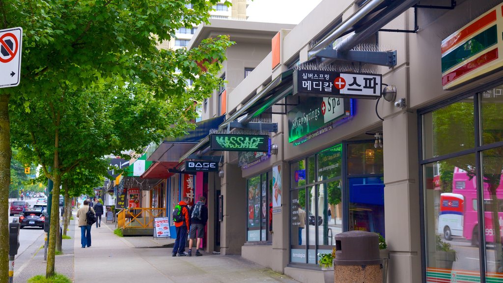 Robson Street which includes a city and street scenes