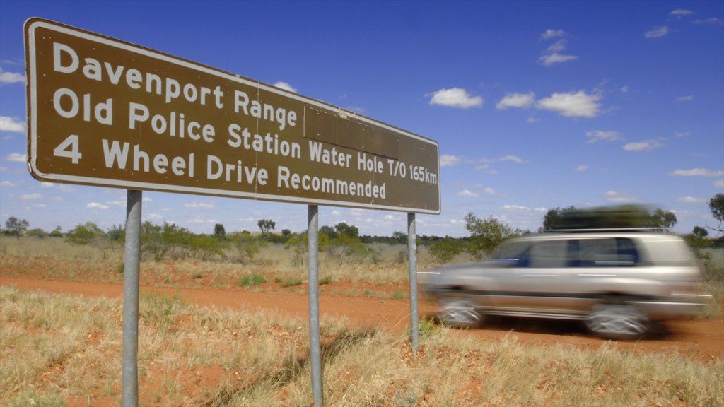 Red Centre featuring touring, tranquil scenes and signage