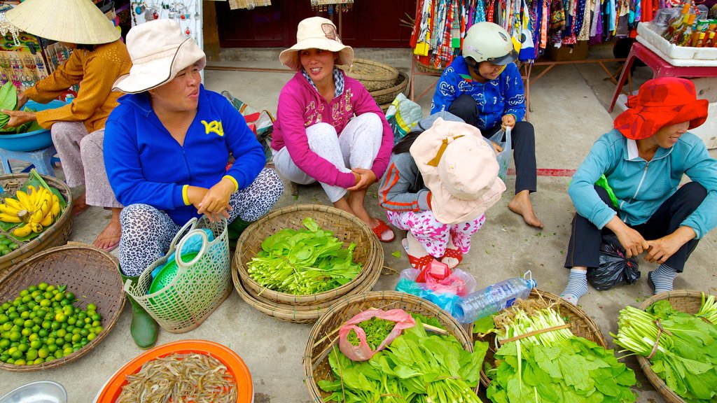 Central Market showing food and markets as well as a small group of people