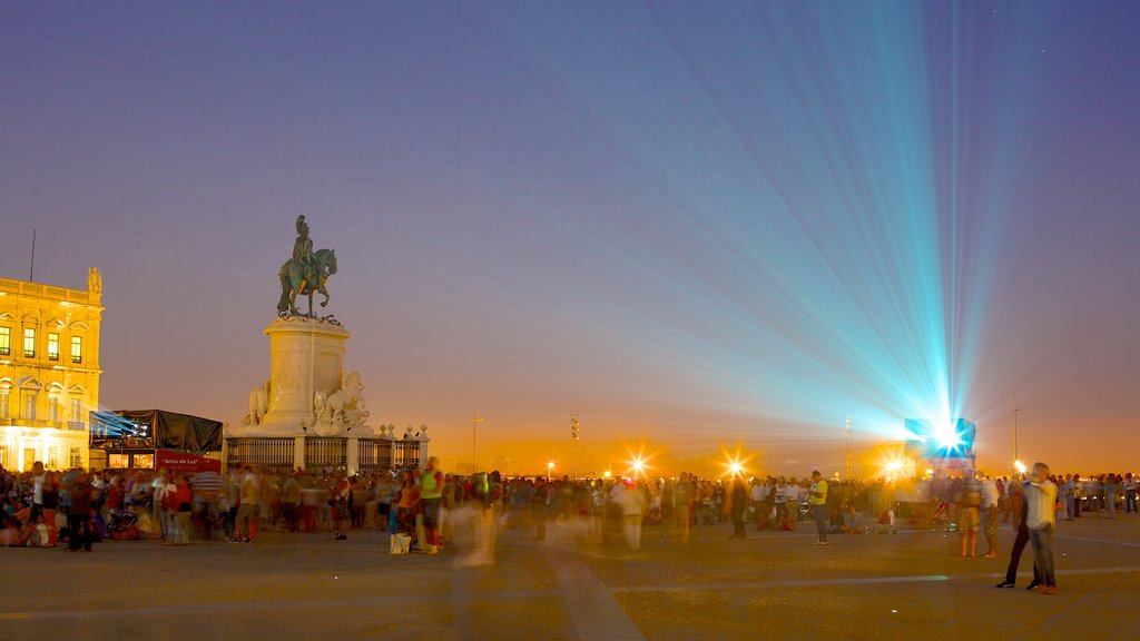 Commerce Square showing nightlife, a city and a statue or sculpture