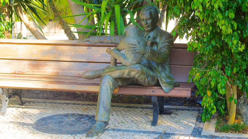 Zoológico de Lisboa mostrando arte al aire libre, un parque y una estatua o escultura