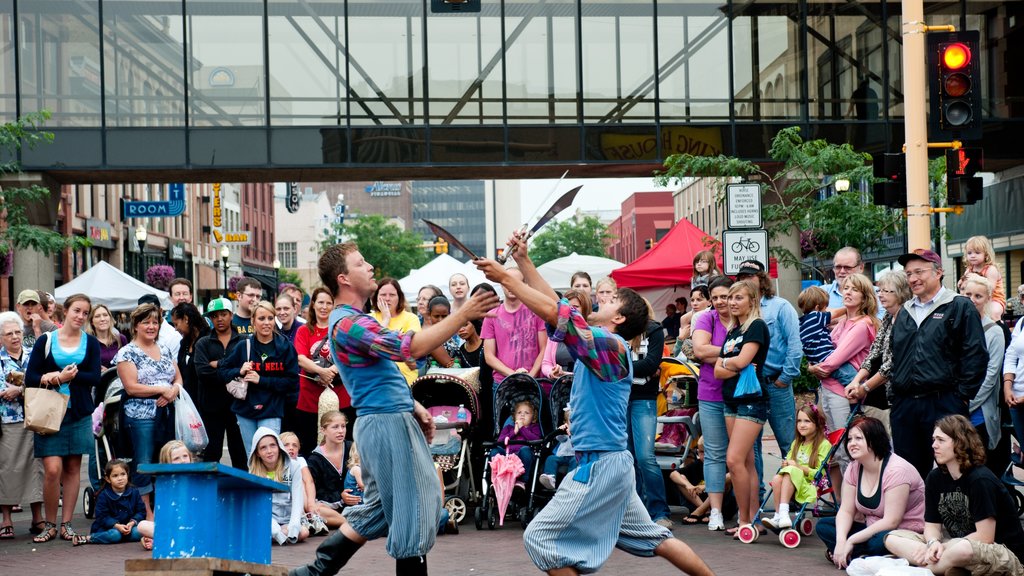 Fargo showing a city and street performance as well as a large group of people