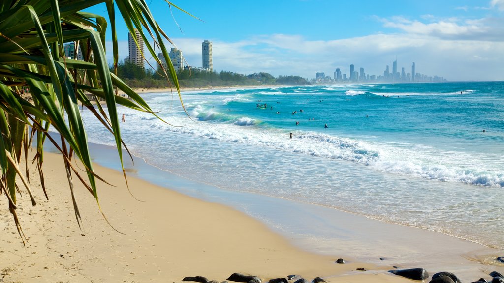 Burleigh Heads showing a coastal town, waves and a beach