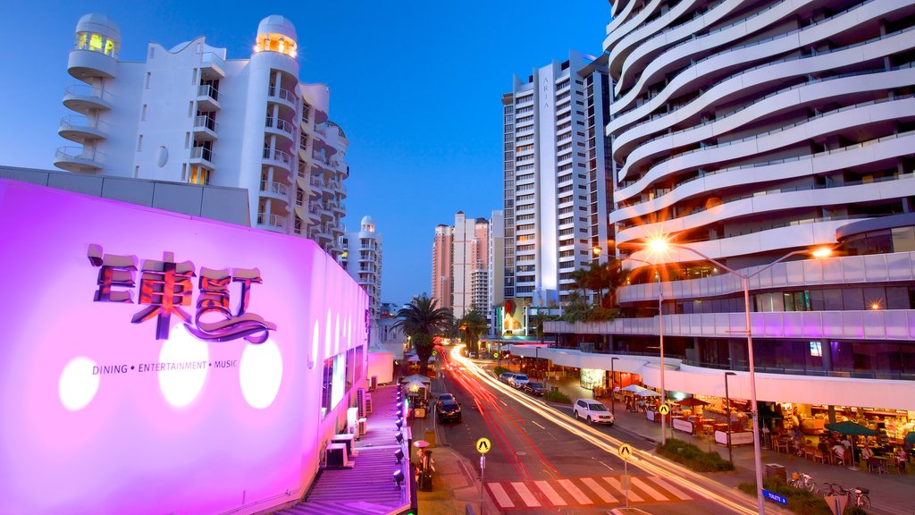 Broadbeach which includes modern architecture, a high-rise building and signage