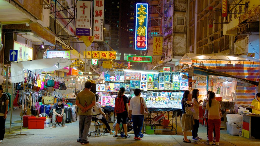 Mercado nocturno de Temple Street que incluye mercados, señalización y escenas nocturnas