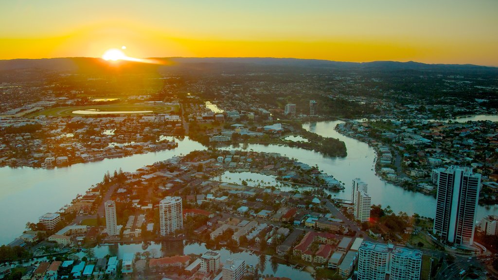 SkyPoint Observation Deck which includes a high-rise building, a sunset and a city