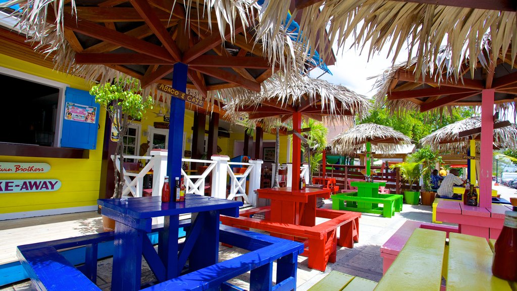 Cayo Arawak mostrando señalización, comidas al aire libre y un hotel de lujo o resort