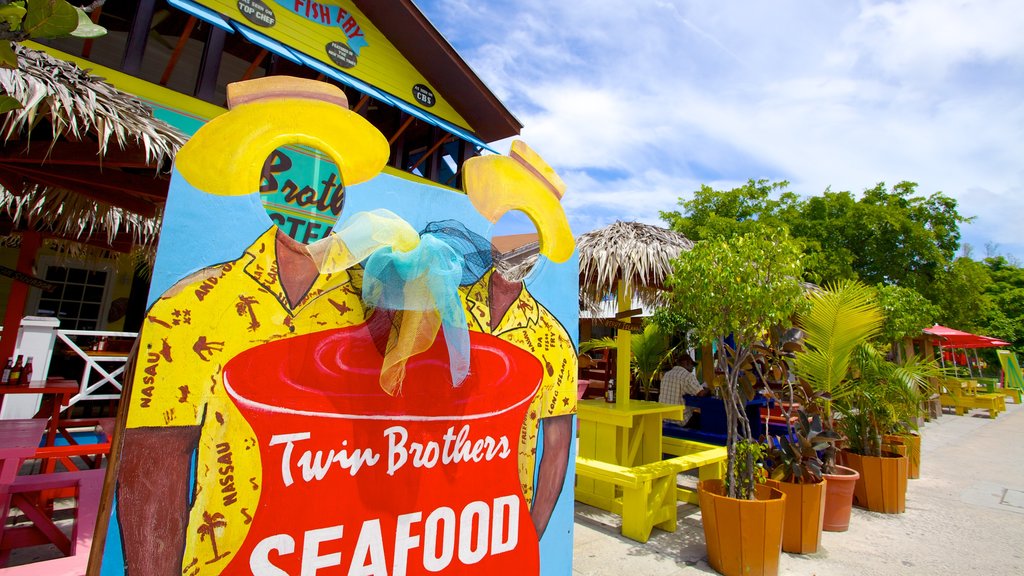 Arawak Cay which includes signage, tropical scenes and outdoor eating