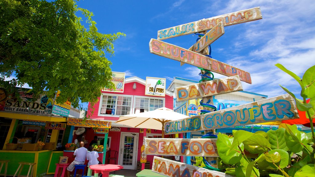 Arawak Cay featuring signage, street scenes and a small town or village