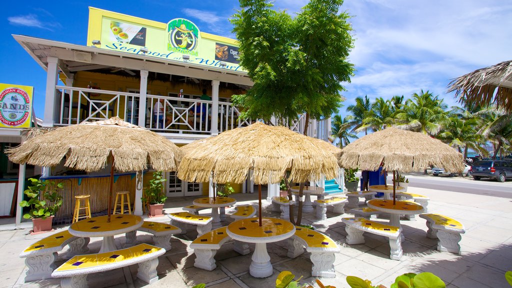 Arawak Cay mostrando uma cidade litorânea, cenas de rua e estilo de vida de cafeteria