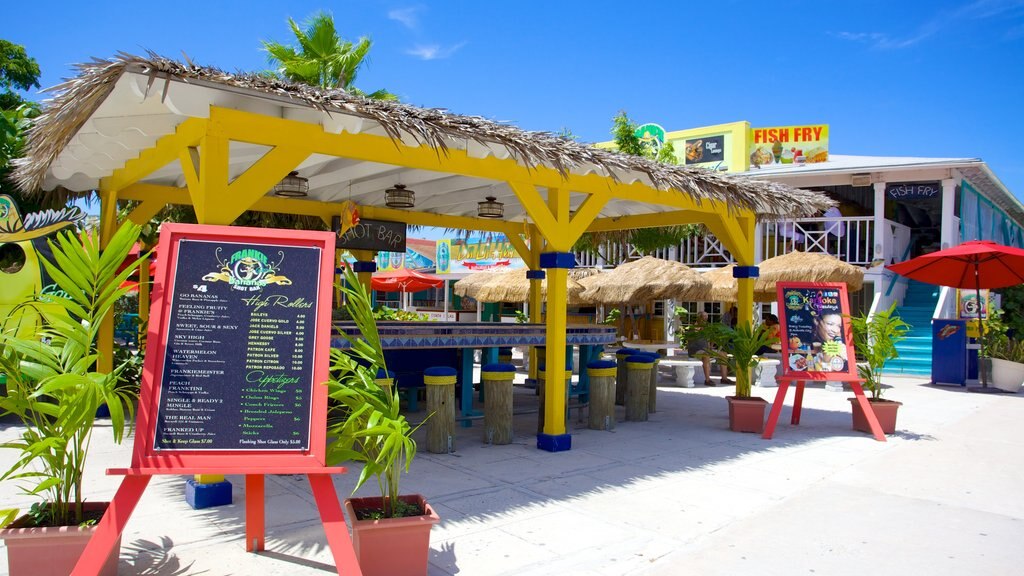 Arawak Cay showing a beach bar, a sandy beach and signage