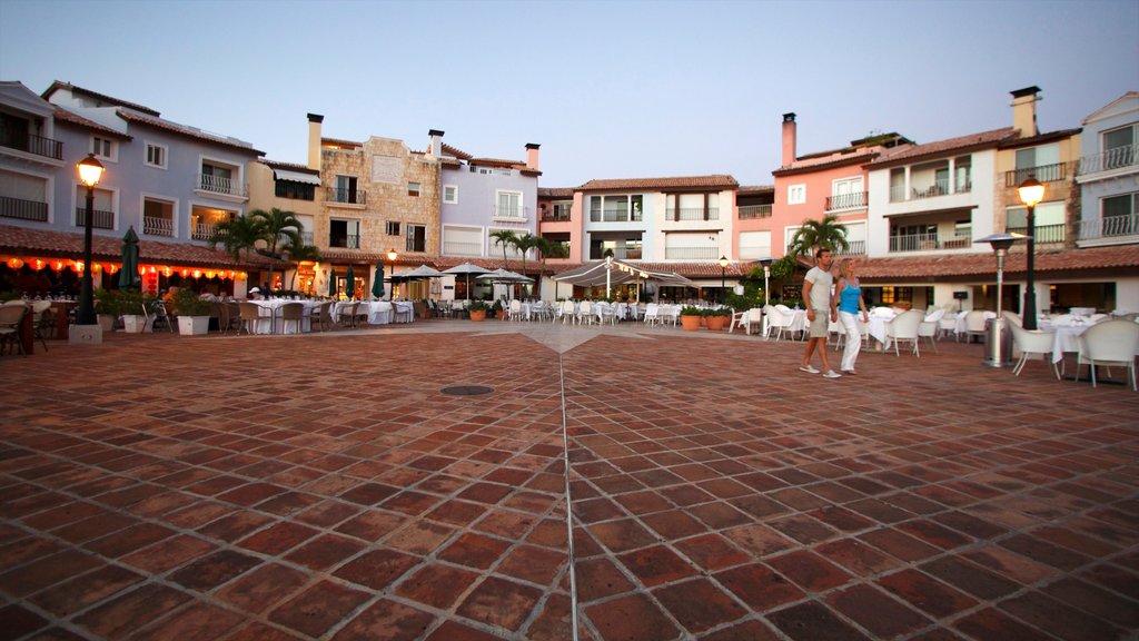 Casa de Campo Marina showing a square or plaza and a house as well as a couple